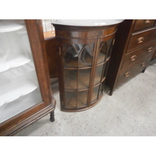 665 - A bow front glazed mahogany vintage wall hanging corner cabinet