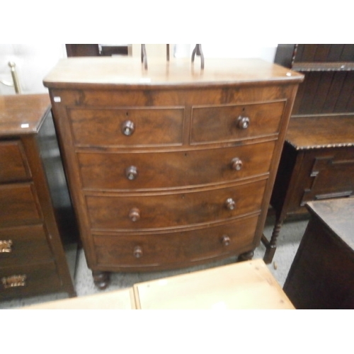 667 - A large antique bow front 2 over 3 drawer mahogany chest