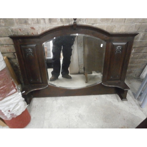 679 - A large vintage over mantel mirror in carved frame