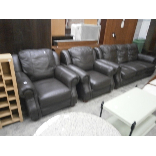 697 - A brown faux leather 3 piece suite with 3 seater settee and 2 x armchairs - a/f arm