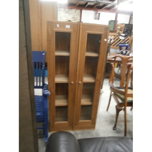 700 - Pair of tall glazed pine cabinets