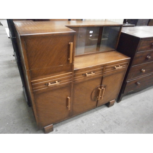 636 - Oak sideboard with glass sliding door display