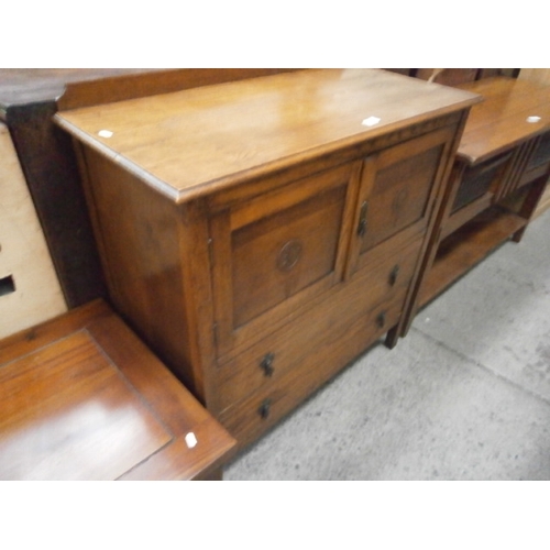 644 - A low oak tallboy with 2 lower drawers