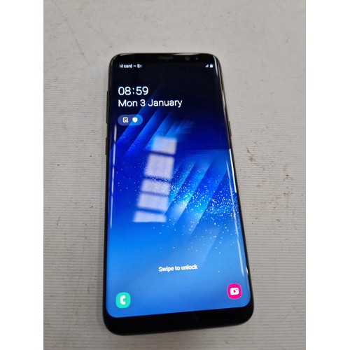 243 - Samsung Galaxy S8 phone with wireless charger and phone case. In full working order.