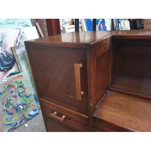 636 - Oak sideboard with glass sliding door display