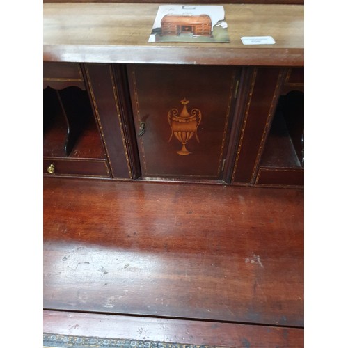 639 - A vintage 7 drawer inlaid mahogany fall front bureau desk with lower centre cupboard - one a/f handl... 