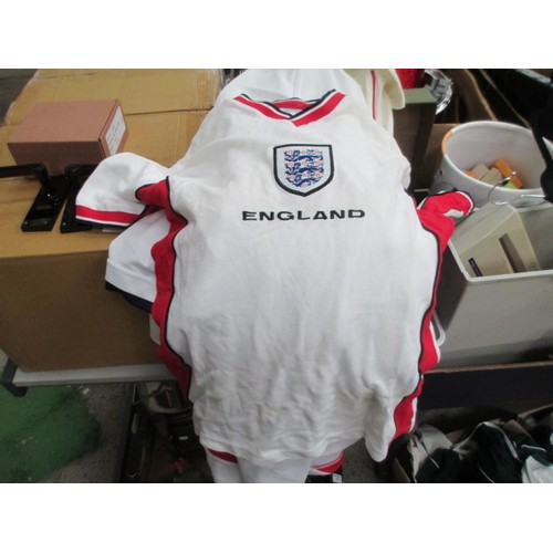 181 - Two boxes of sporting tops