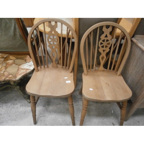 707 - A pair of wheelback kitchen chairs