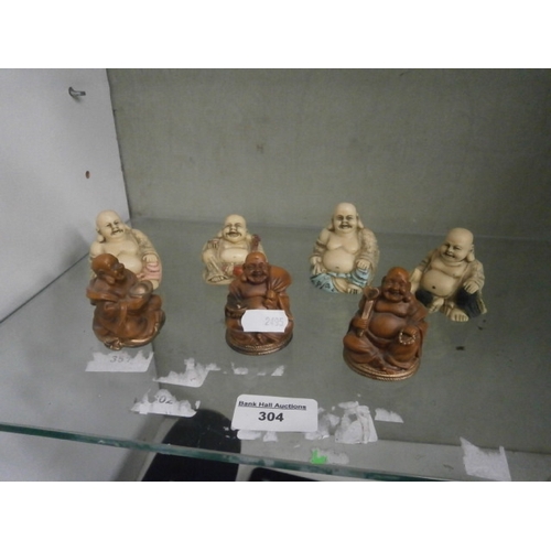 304 - Seven miniature Buddha figurines