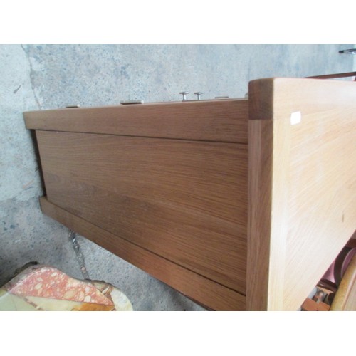 705 - A small 2 drawer light oak base unit