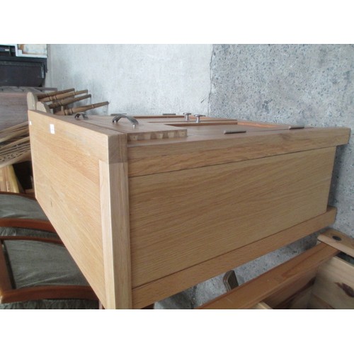 705 - A small 2 drawer light oak base unit