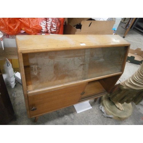 741 - A small retro cabinet with sliding doors