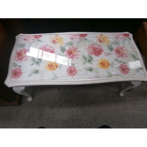 648 - A vintage painted glass top coffee table