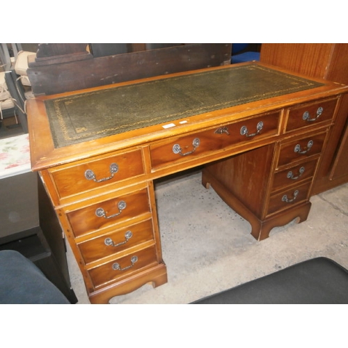 A leather topped 8 drawer vintage pedestal desk