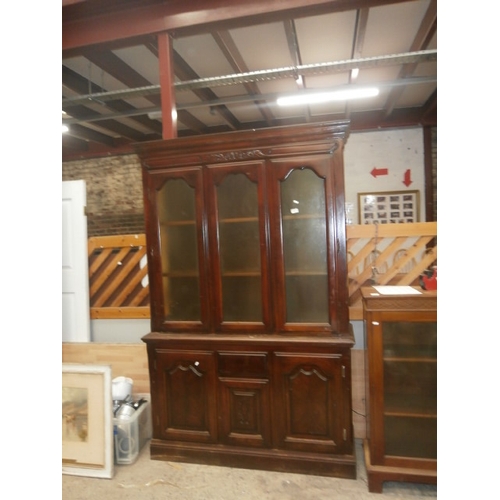 725 - A large vintage wall unit with glazed upper cabinets on single drawer double cupboard base