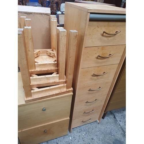 715 - A tall 7 drawer chest, a 2 drawer chest and a nest of 3 x tables