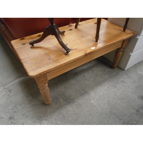 A vintage solid pine coffee table