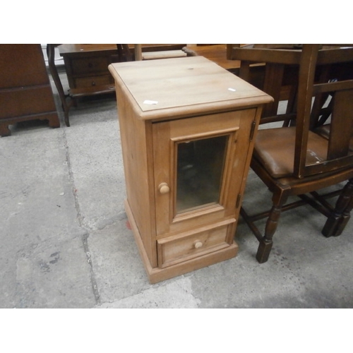 700 - A small base cabinet with glazed door and a lower drawer