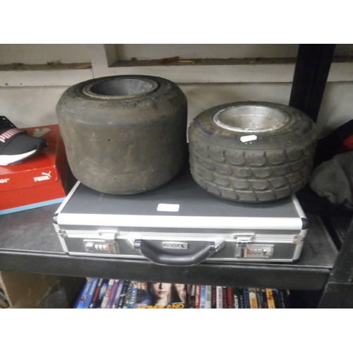 49 - Two go kart wheels and metal guard x lockable case