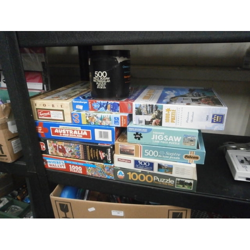 74 - Twelve assorted jigsaws