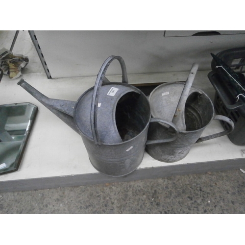 343 - Two galvanised watering cans