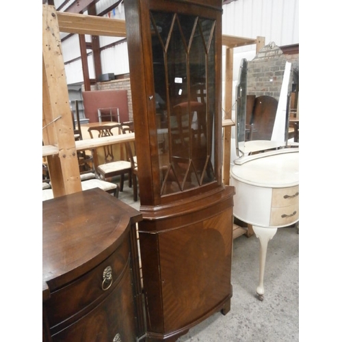 645 - A vintage glazed mahogany corner cabinet