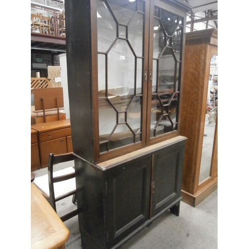 650 - A large antique glazed mahogany cabinet on double cupboard base