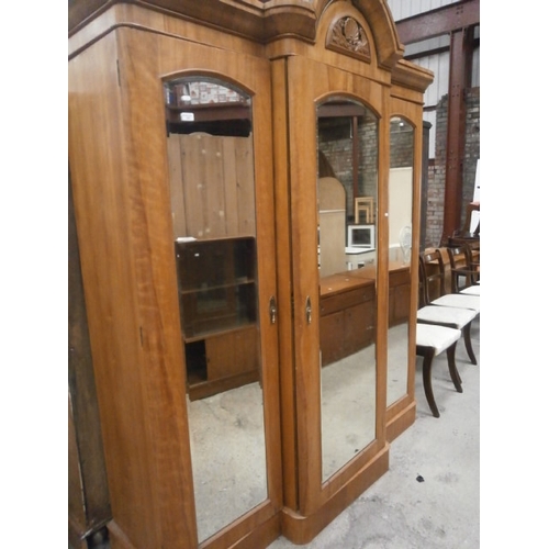 652 - A large antique Satinwood triple wardrobe unit with mirrored doors and fitted centre section