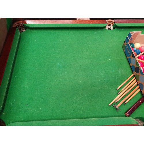 691 - Dining/slate bed Snooker/pool table with with cues balls etc