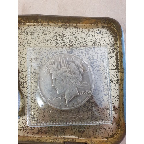 100 - Tin of vintage coins inc America dollar & old lead figure