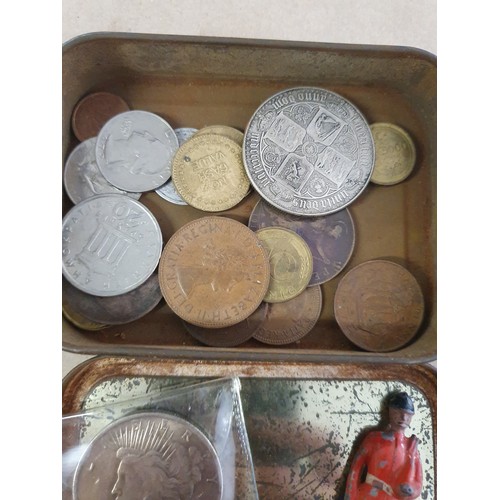 101 - Tin of vintage coins inc America dollar & old lead figure