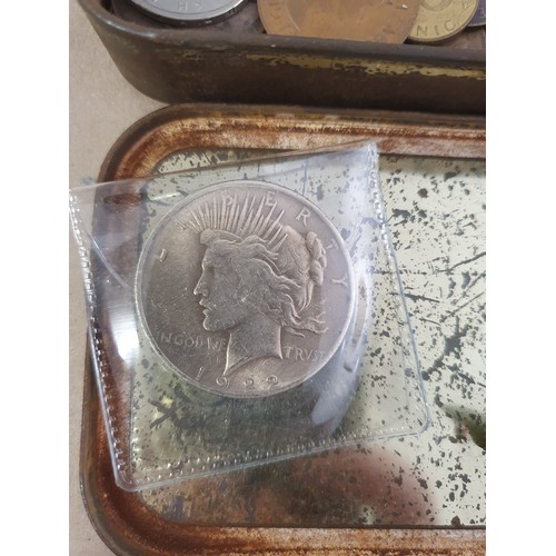 101 - Tin of vintage coins inc America dollar & old lead figure