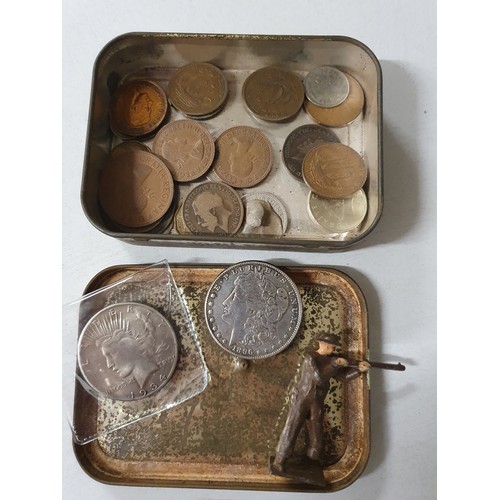 106 - Tin of vintage coins inc America dollar & old lead figure