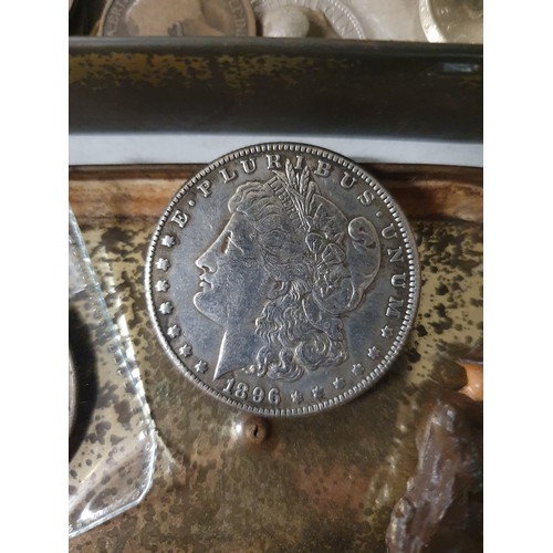 106 - Tin of vintage coins inc America dollar & old lead figure
