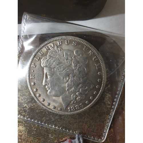 107 - Tin of vintage coins inc America dollar & old lead figure