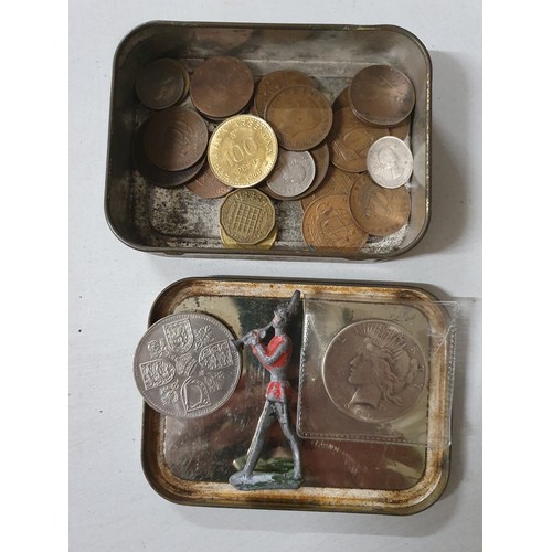109 - Tin of vintage coins inc America dollar & old lead figure