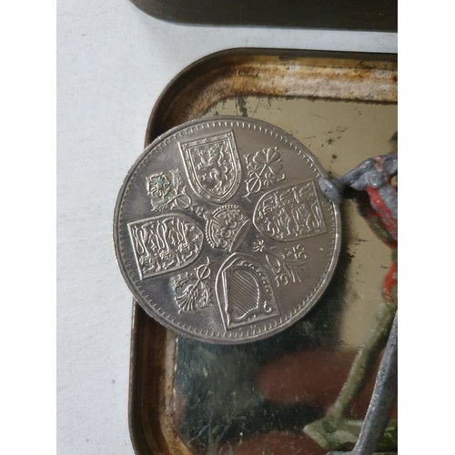 109 - Tin of vintage coins inc America dollar & old lead figure