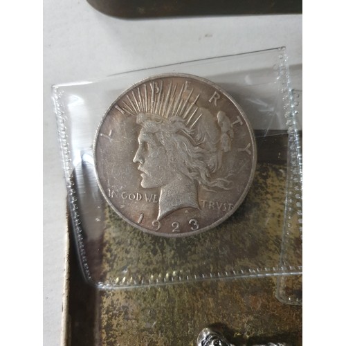 111 - Tin of vintage coins inc America dollar & old lead figure