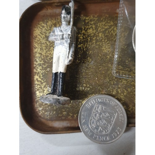 112 - Tin of vintage coins inc America dollar & old lead figure