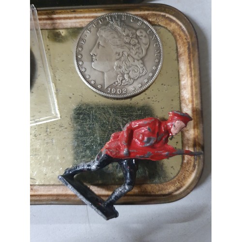 119 - Tin of vintage coins inc America dollar & old lead figure