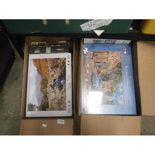 51 - Two boxes of assorted Jigsaws