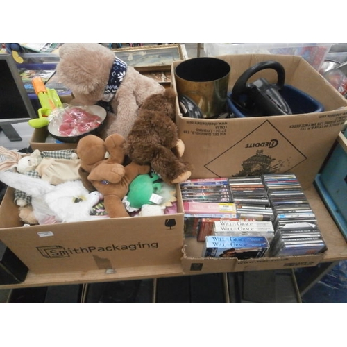 147 - Four boxes inc soft toys, water guns, CDs, gaming steering wheel, etc