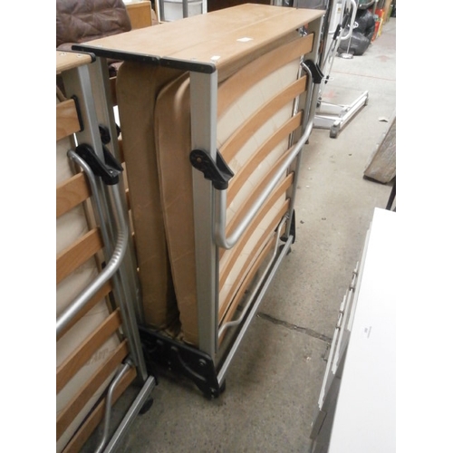 665 - A folding single guest bed with mattress