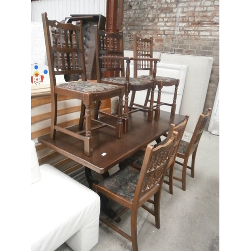 670 - A large vintage refectory style dining table and 6 x matching chairs