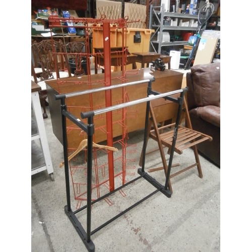 673 - A small double hanging rail, a metal retail display stand and an af folding wooden chair