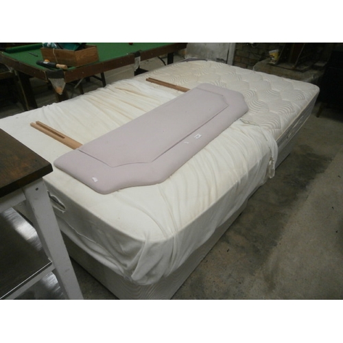 679 - A 4ft divan bed with mattress and headboard