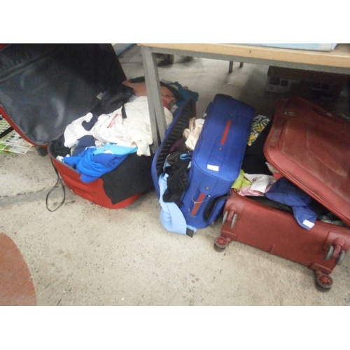 176 - Three suitcases containing clothing