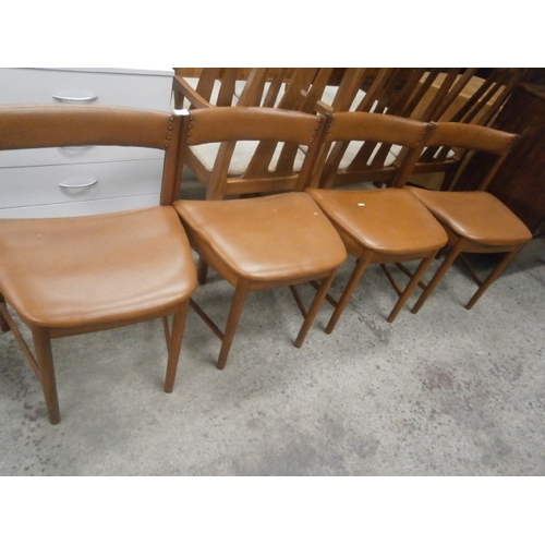 666 - A set of 4 x teak mid century dining chairs with shaped faux leather seats and backs