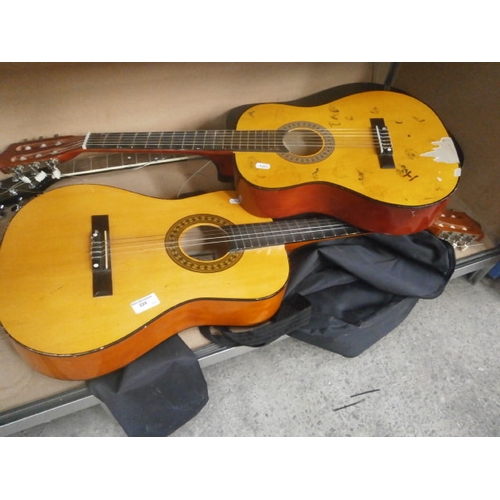 220 - Three assorted guitars