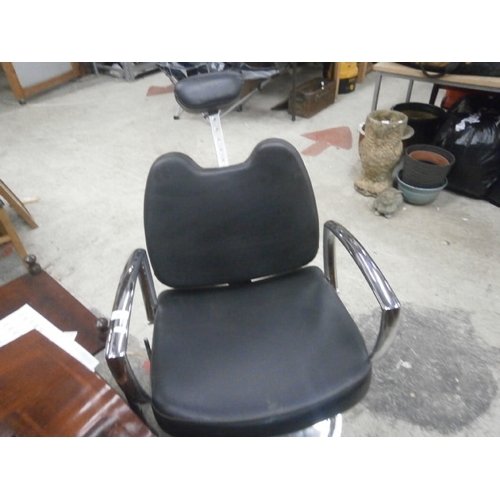 687 - A faux leather salon chair on chromed frame